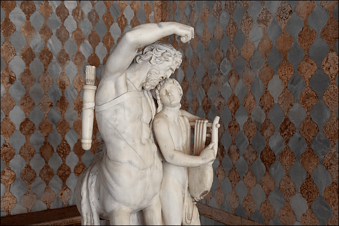 Sculpture by Rinaldo Rinaldi (XVIII° siècle) of Chiron the Centaur teaching the zither to Achilles, exhibited at the Academy of Fine Arts in Venice, then moved to the Ca d'Oro loggia.